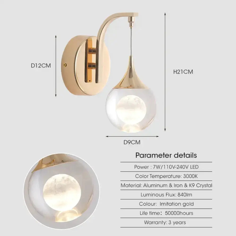 Modern luxurious crystal led wall sconce with gold-toned curved design and teardrop-shaped crystal globe for bedroom