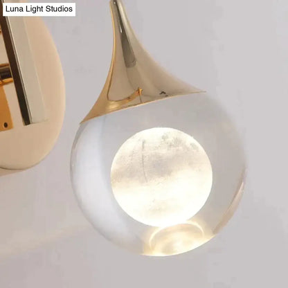 Modern luxurious crystal led wall sconce with gold curved metal top and translucent glass body featuring moon design