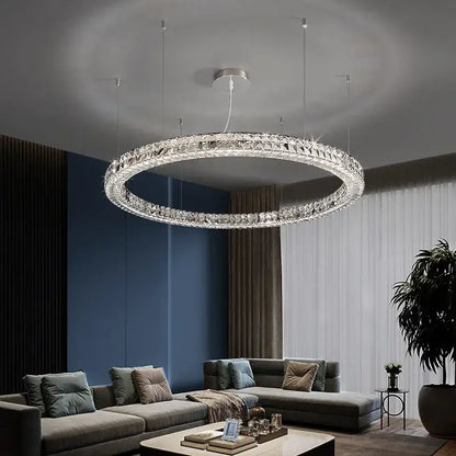 A modern luxury chrome decorbites crystal led chandelier with a silver frame and crystal facets for dining room use