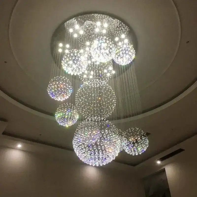 A modern luxury led chandelier with cascading clear and iridescent glass spheres for living room decorbites crystal ball
