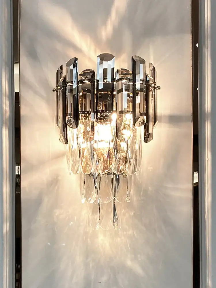 Modern luxury crystal gold led wall sconce with sleek chrome frame and cascading clear crystal prisms for bedroom decorbites crystal gold