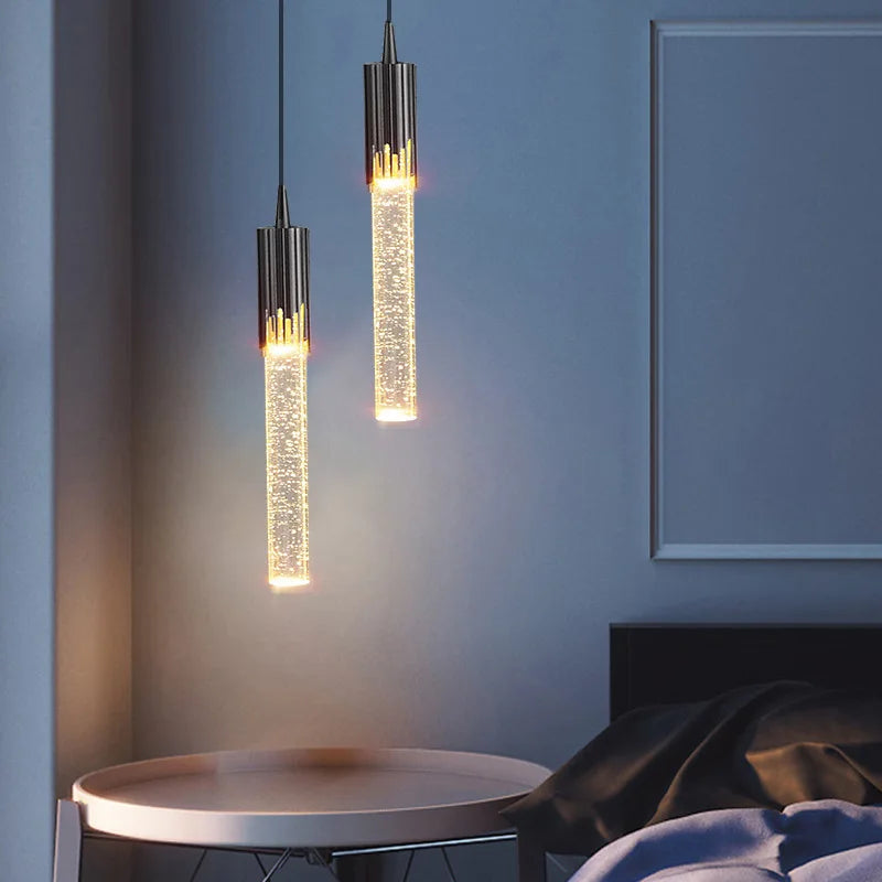 Two modern luxury crystal pendant lamps with golden bubble glass bodies and black metal caps for living room decor