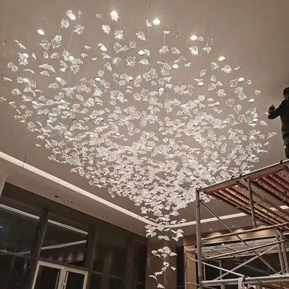 Modern luxury glass high ceiling led chandelier with clear crystal leaf pieces for living room decorbites glass high design