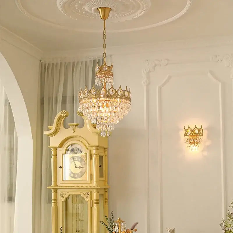 Modern luxury gold crystal crown chandelier with intricate detailing and dangling crystal droplets for living room decorbites crystal crown