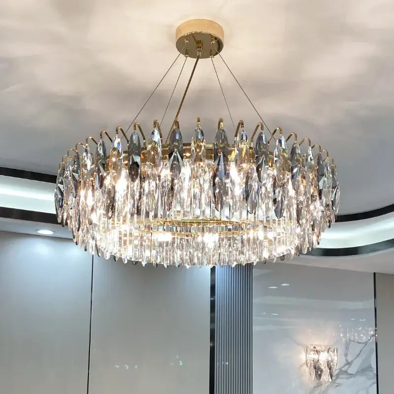 A modern luxury gold decorbites crystal atmosphere chandelier with cascading clear crystal droplets for dining room