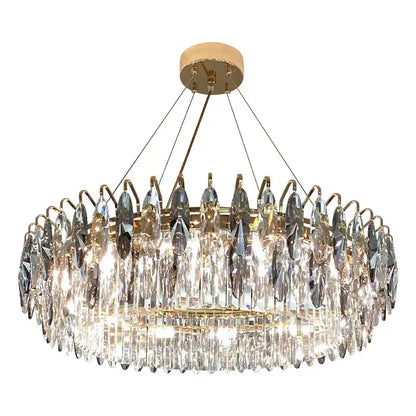 Modern luxury gold decorbites crystal atmosphere chandelier with clear faceted crystals on a brass frame for dining room