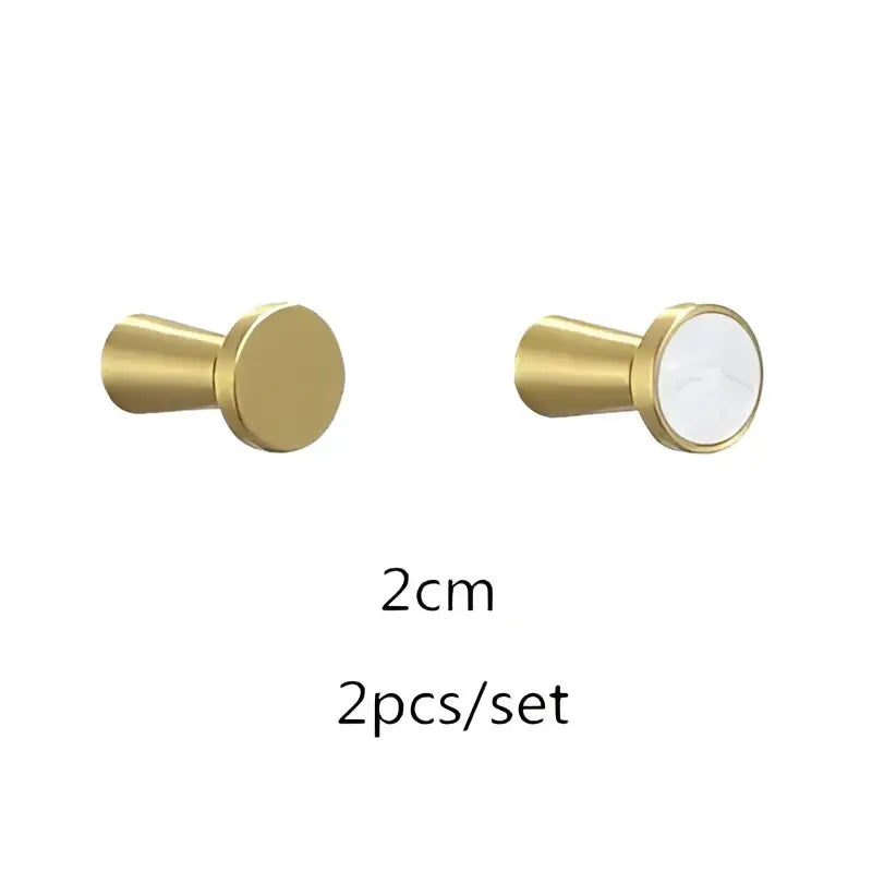 Modern marbled stone and decorbites brushed gold towel hook with gold metallic knob and white circular inlay for bathroom decor