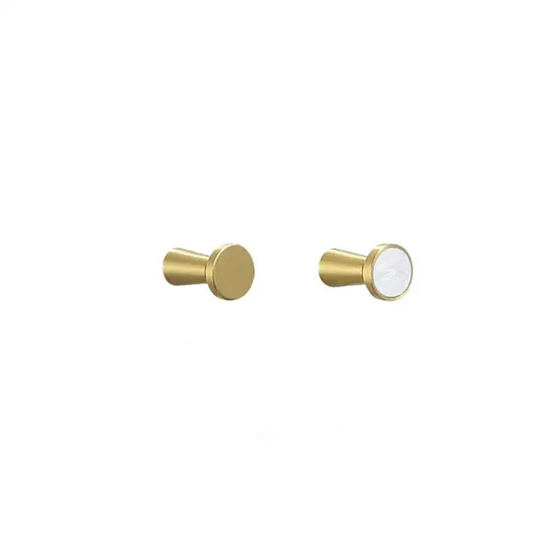 Modern marbled stone and decorbites brushed gold towel hook with cylindrical design and white accent for bathroom decor