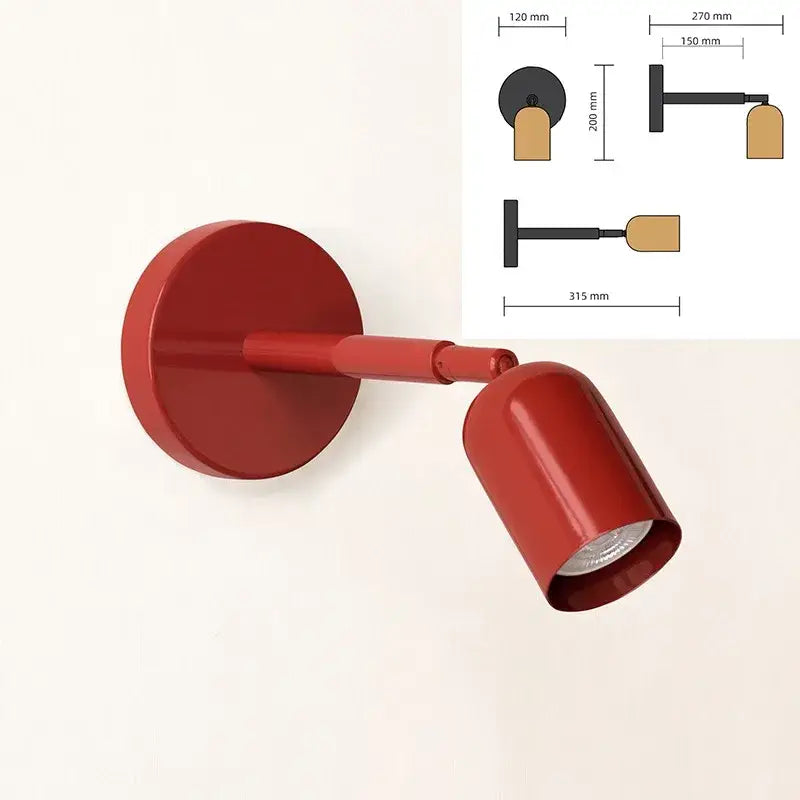 Red wall sconce with a sleek cylindrical design matte finish and adjustable gu10 led for modern bedroom lighting