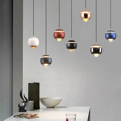 Modern matte ball pendant lights in white, brushed copper, black, and metallic blue for bedroom and kitchen island
