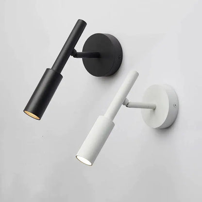 Modern matte black adjustable led wall lamp with cylindrical shades for bedroom reading as a minimalist wall lamp