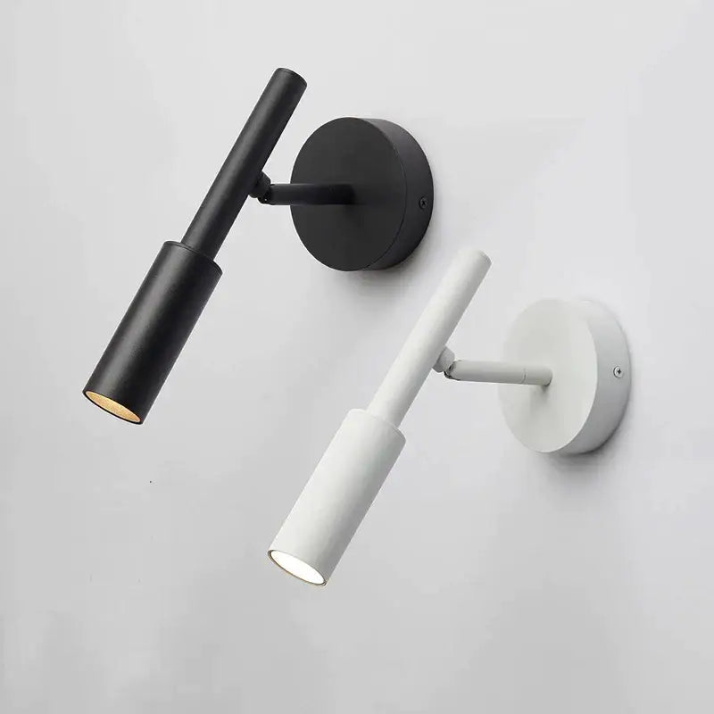Modern matte black adjustable led wall lamp with cylindrical shades for bedroom reading as a minimalist wall lamp
