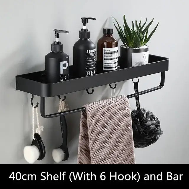 Modern matte black aluminum corner shelf with integrated bar and six hooks holding soap dispensers and towels