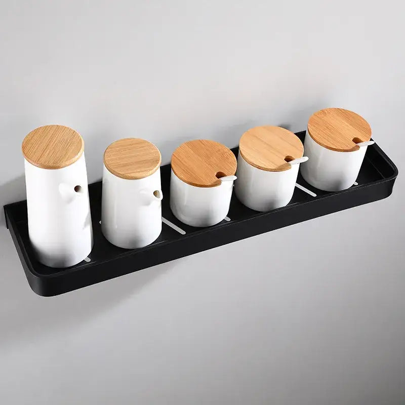 Modern matte black aluminum corner shelf with white ceramic spice jars and bamboo lids for black aluminum bathroom storage