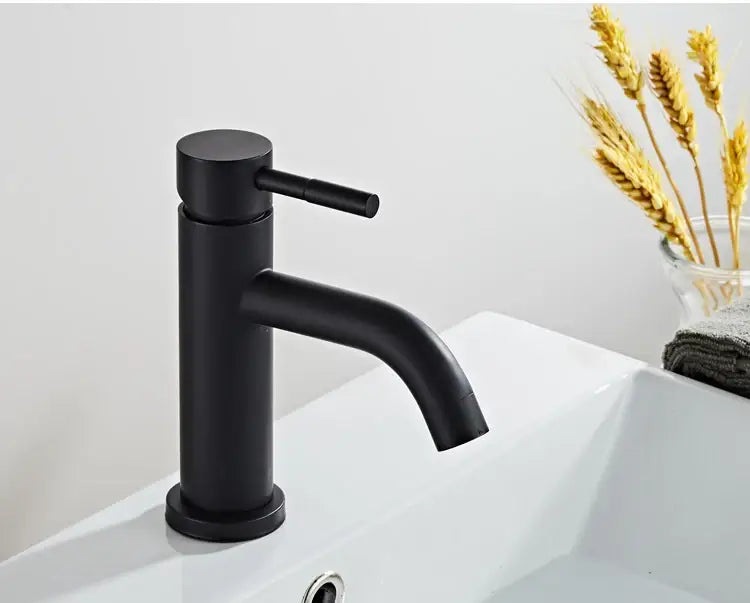Modern matte black baking stainless basin faucet with sleek cylindrical body and curved spout by decorbites black baking
