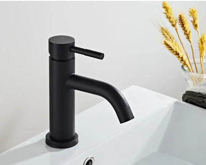 Modern matte black baking stainless basin faucet with sleek cylindrical body and curved spout by decorbites black baking