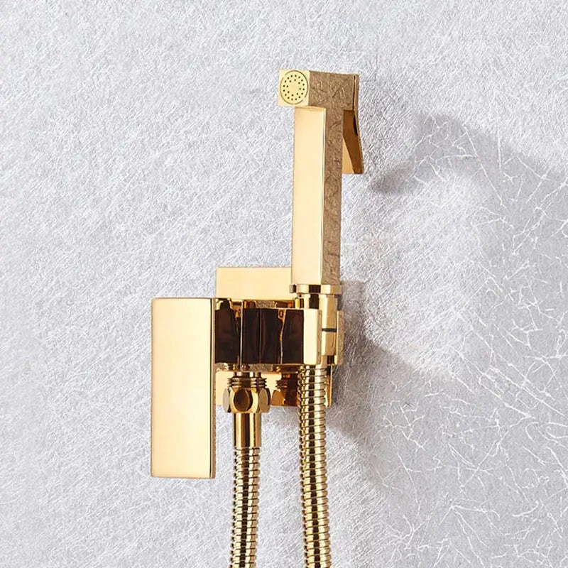 Gold-finished modern bidet shower faucet with sleek rectangular design and textured accents from decorbites shower faucet set