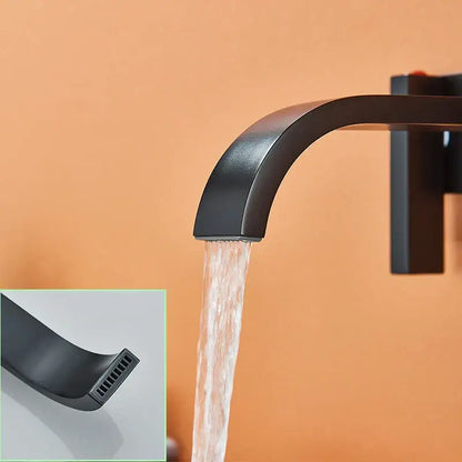 Modern matte black brass wall mounted basin faucet with sleek curved spout and waterfall design by decorbites black brass