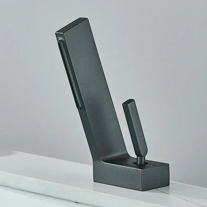 Matte black metal coat hook with sleek modern design and sturdy base complementing decorbites brass waterfall basin faucet