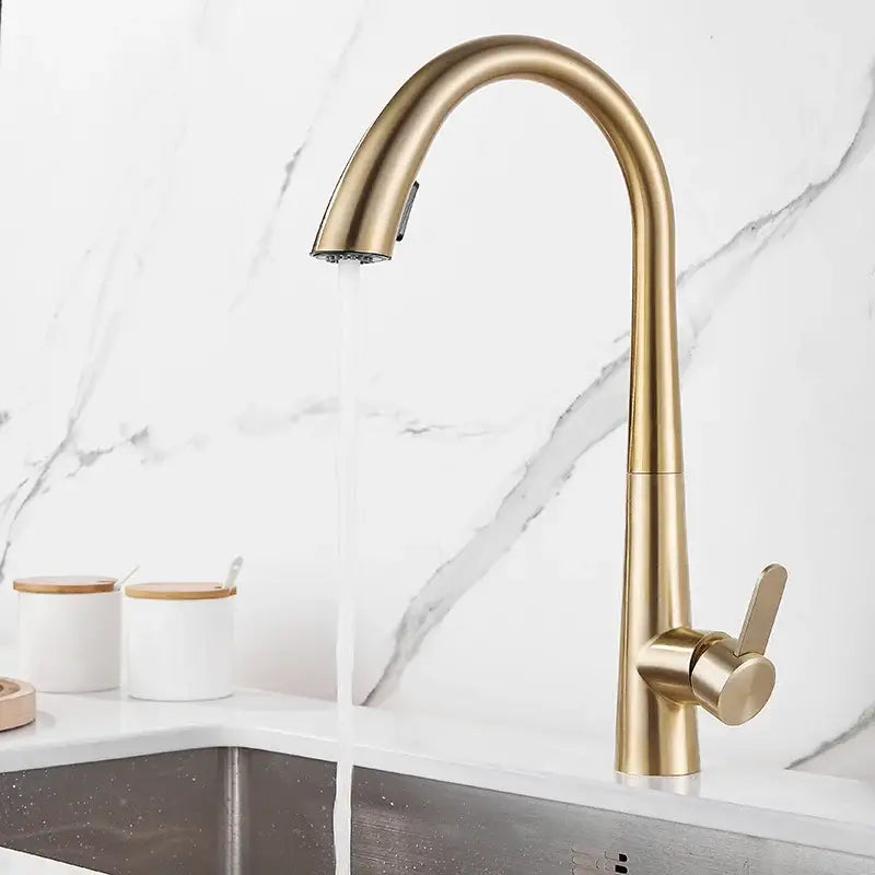 Modern matte black and brushed gold kitchen faucet with gold-toned curved spout and pull-down spray head for decorbites black brushed gold decor