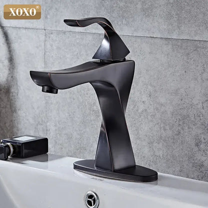 Modern matte black xoxo basin faucet with sleek angular contours in decorbites contemporary brass basin design