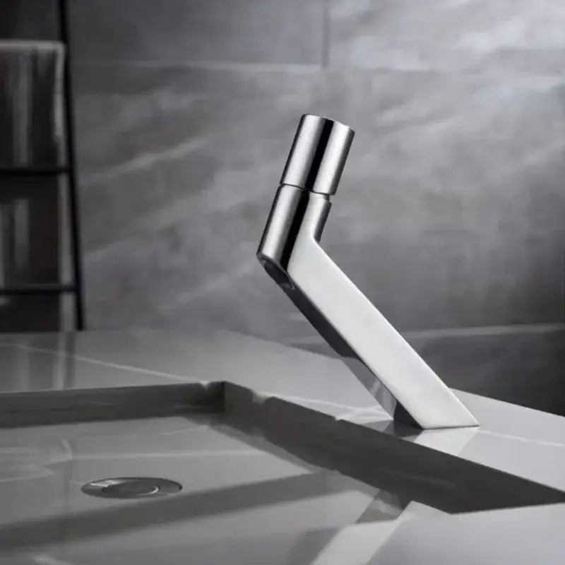 Modern chrome-finished decorbites basin faucet with sleek angular design for bathroom sink use