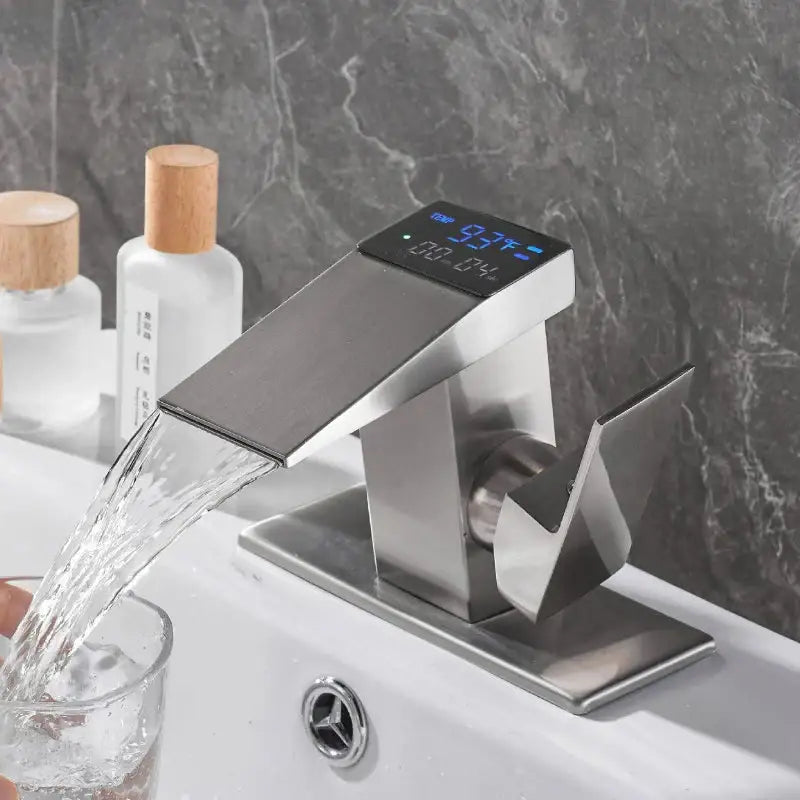 Modern matte black stainless steel basin faucet with sleek angular design and decorbites digital display showing temperature