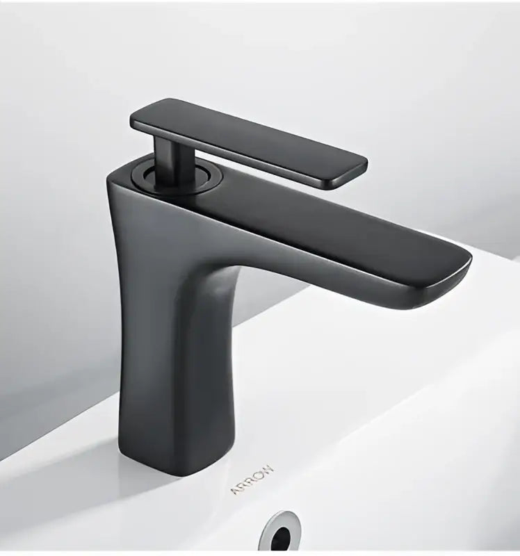 Modern matte black and gold decorbites basin faucet with sleek minimalist design for bathroom use