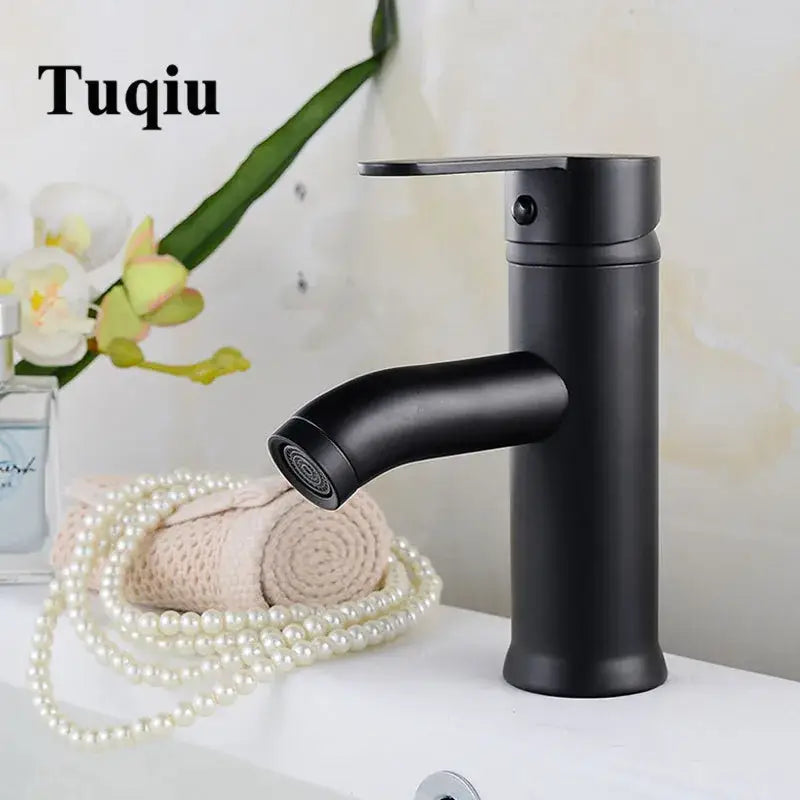Modern matte black and gold single handle wash basin faucet with curved spout decorbites black single handle design