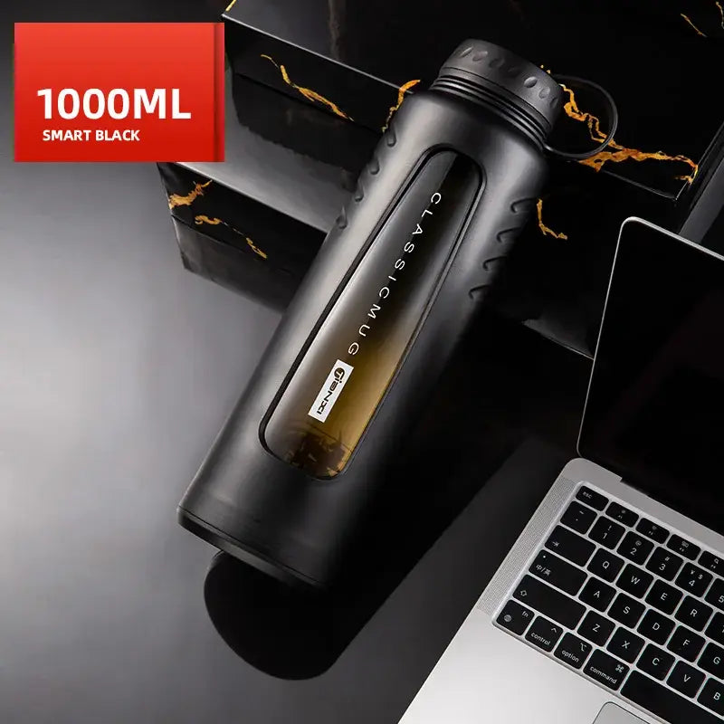 Modern matte black insulated glass water cup featuring a 1000ml smart black bottle with textured grip and gold branding
