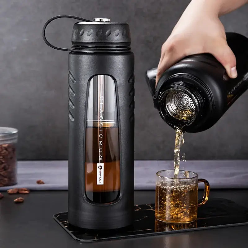 Modern matte black insulated glass water cup with textured grip and transparent window featuring classic mug branding