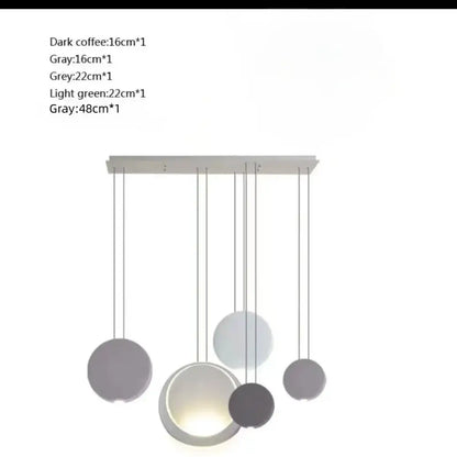 Modern matte black and muted green crescent moon chandelier with spherical pendant shades in dark coffee gray and light green tones by decorbites crescent moon