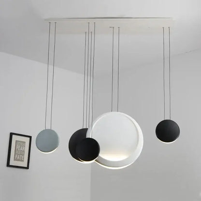 Modern matte black and muted green crescent moon chandelier with multiple circular shades by decorbites crescent moon decor