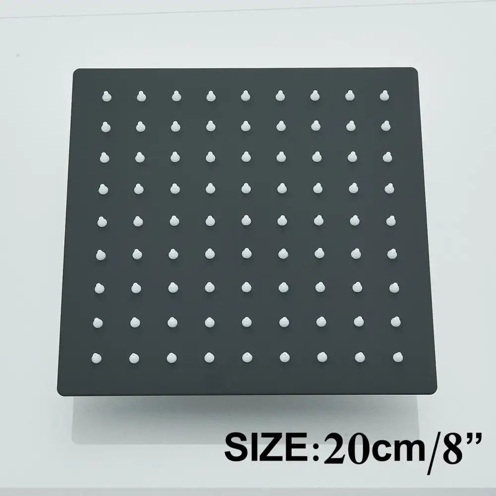 Modern matte black shower head set with a square rainfall shower head featuring white nozzle grid design