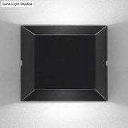 Modern matte black rectangular led wall sconce with angular design and matte finish for balcony outdoor lighting