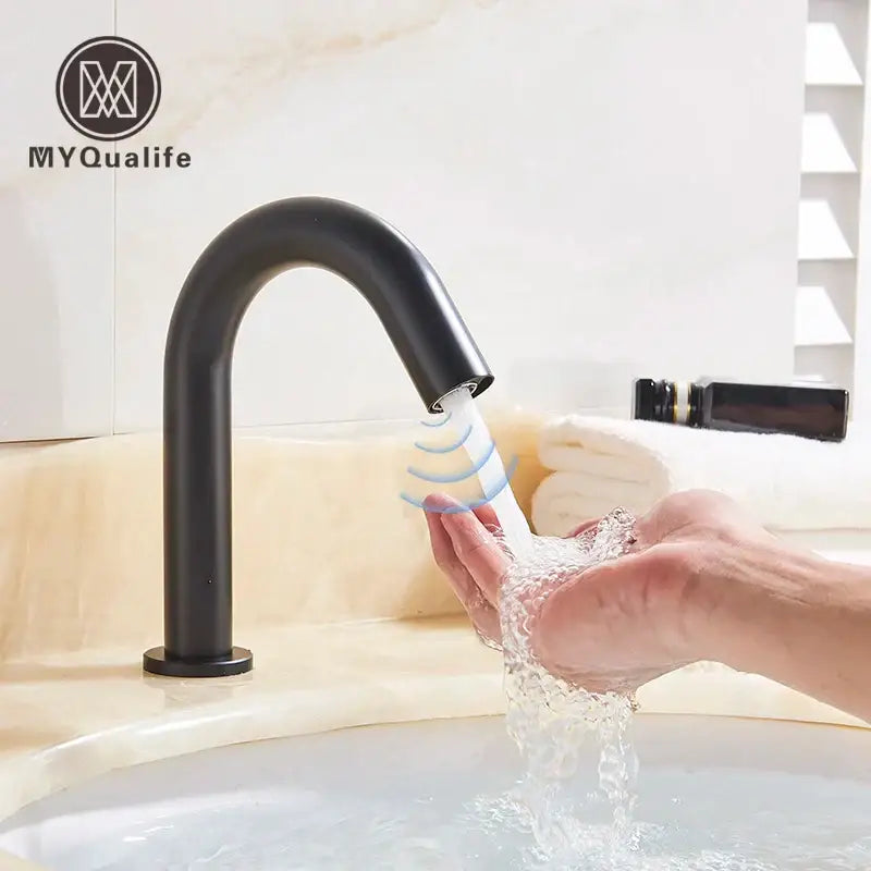 Modern matte black sensor faucet with sleek curved spout and cylindrical base for bathroom use by decorbites black sensor