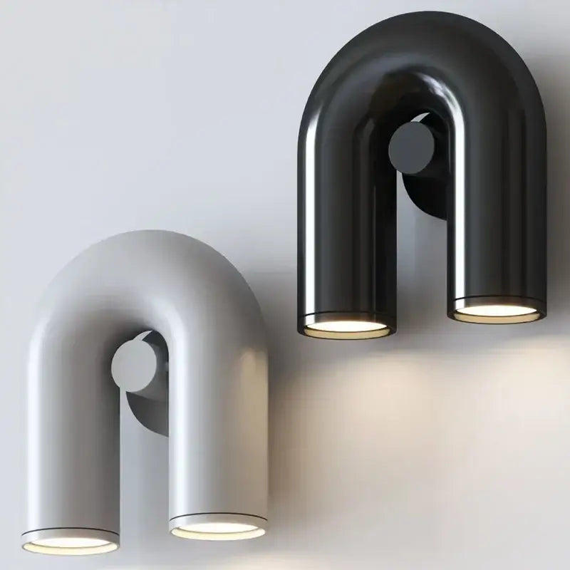 Modern matte black and silver tube wall lamp with minimalist u-shaped design and two cylindrical light fixtures for bedroom decorbites cirkus tube