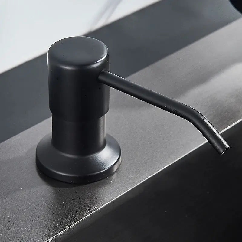 Modern matte black soap dispenser with stainless steel head featuring a sleek design for kitchen use