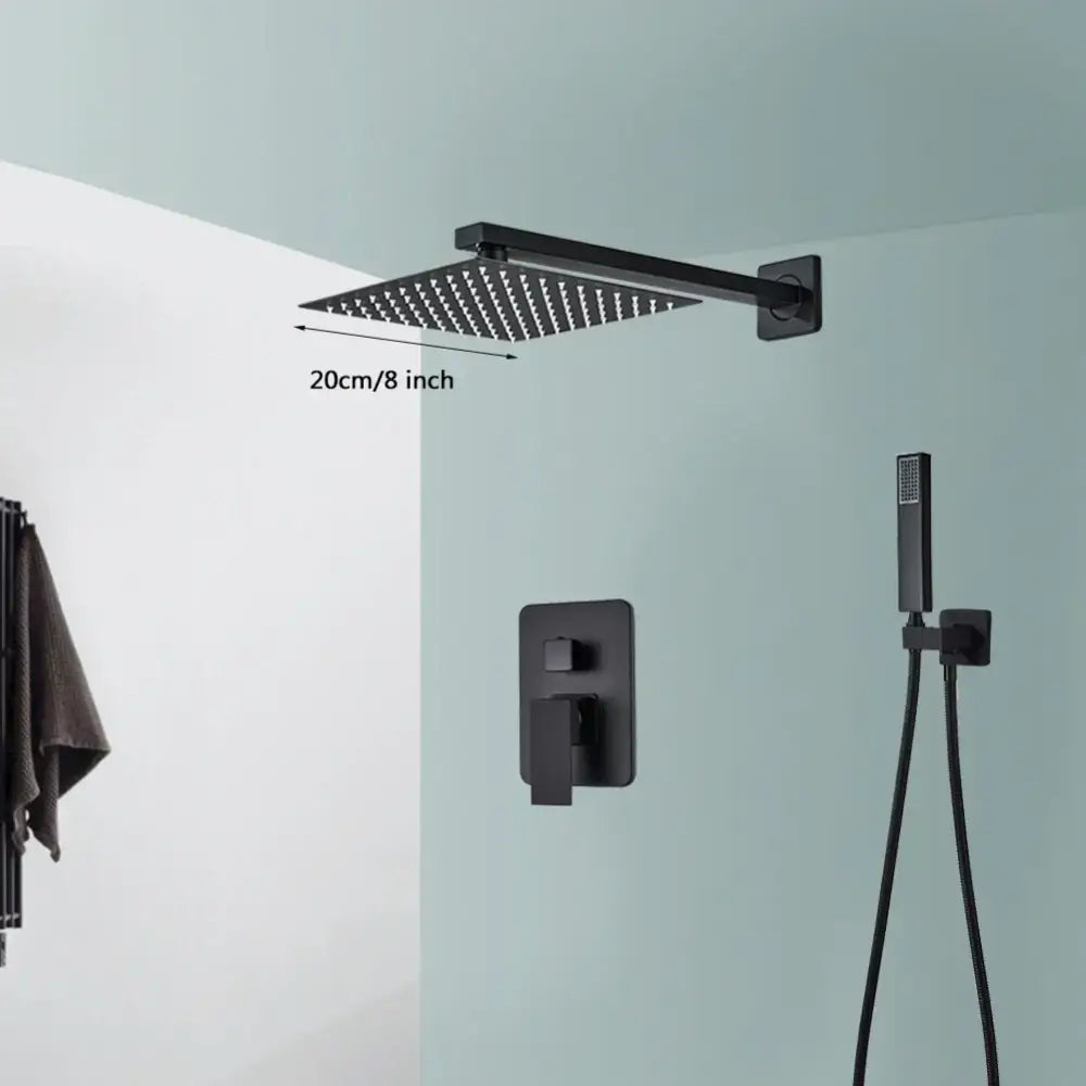 Modern matte black wall mounted rainfall shower with tub spout featuring a black wall mounted square matte rainfall showerhead