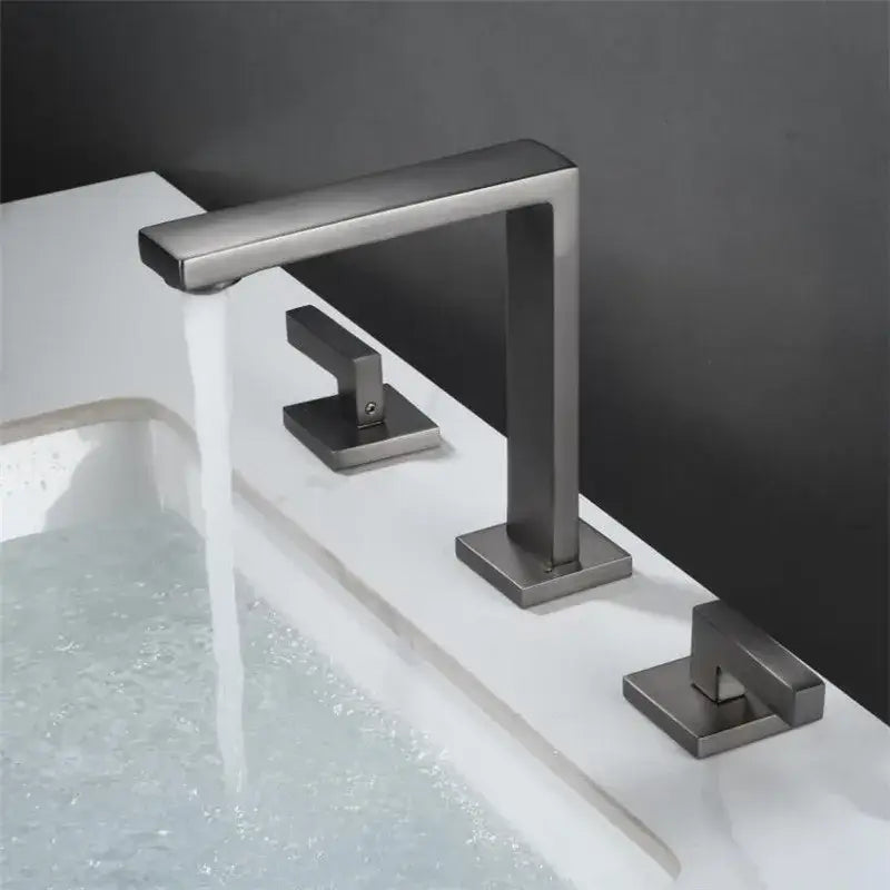 Modern matte black waterfall basin faucet with sleek rectangular design and three square-mounted handles for bathroom decorbites brushed gold style