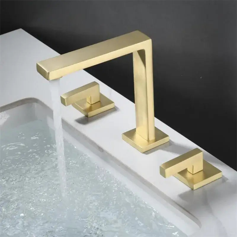 Modern brushed gold basin faucet with two square handles and minimalist design by decorbites brushed gold