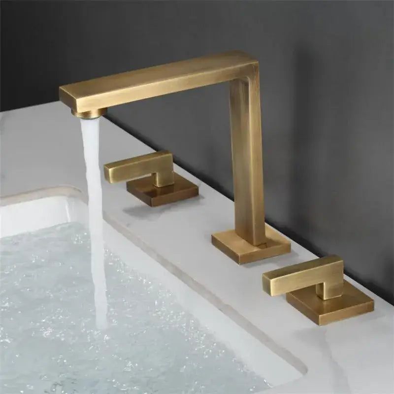 Modern brushed gold basin faucet with three separate handles for hot cold and overflow control by decorbites brushed gold