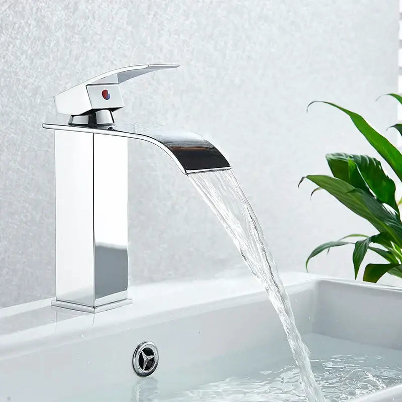 Modern chrome waterfall faucet mixer tap with sleek angular design and single red indicator button for basin faucet