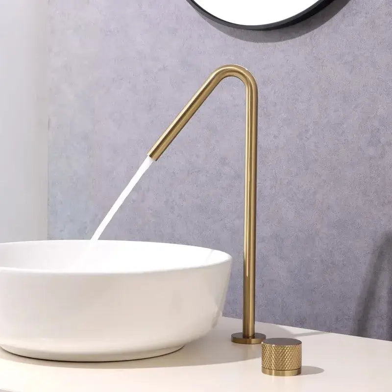 Modern matte brushed black basin faucet with brass-finished sleek curved spout and textured cylindrical handle by decorbites