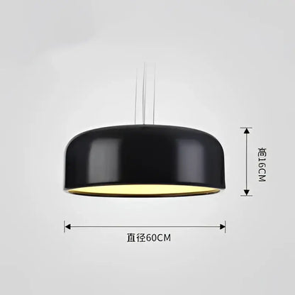 Modern matte green macaron ceiling chandelier featuring a black matte pendant light with warm yellow interior glow decorbites colorful macaron