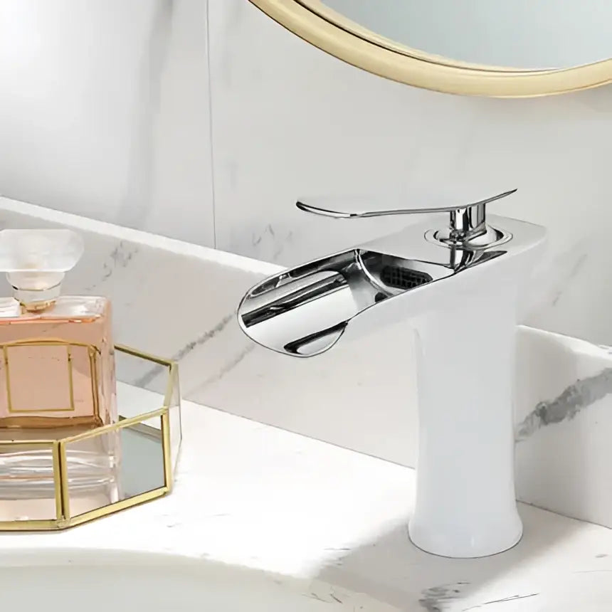 Chrome-finished basin faucet with sleek modern design and cylindrical base in decorbites grey waterfall brass style