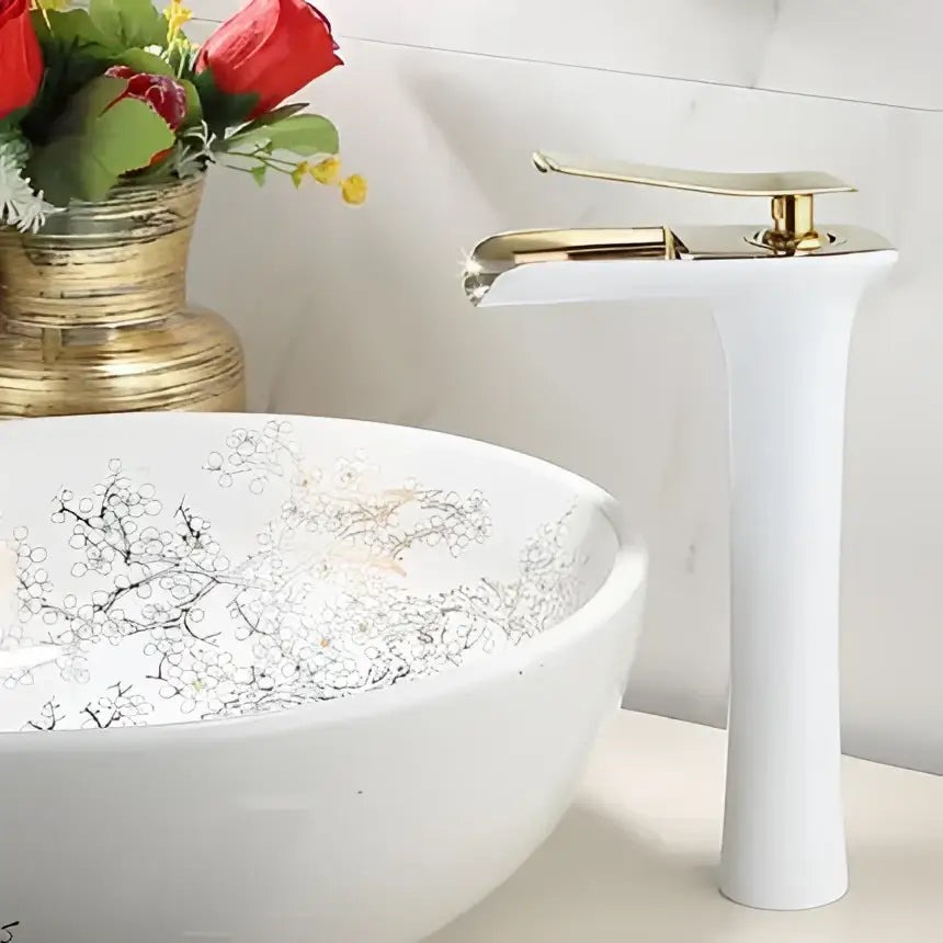 White ceramic bowl sink with silver floral pattern paired with modern matte grey waterfall brass basin faucet decorbites grey waterfall