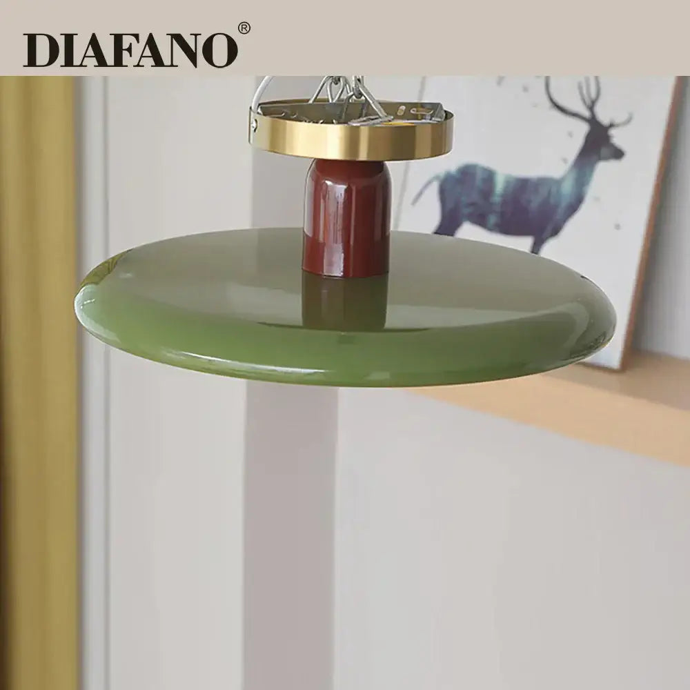 Diafano pendant ceiling light with glossy olive green shade and polished brass top fixture for modern living room use