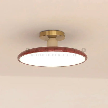 Modern matte white and brass led ceiling light with a glossy red rim and warm white illumination for living room