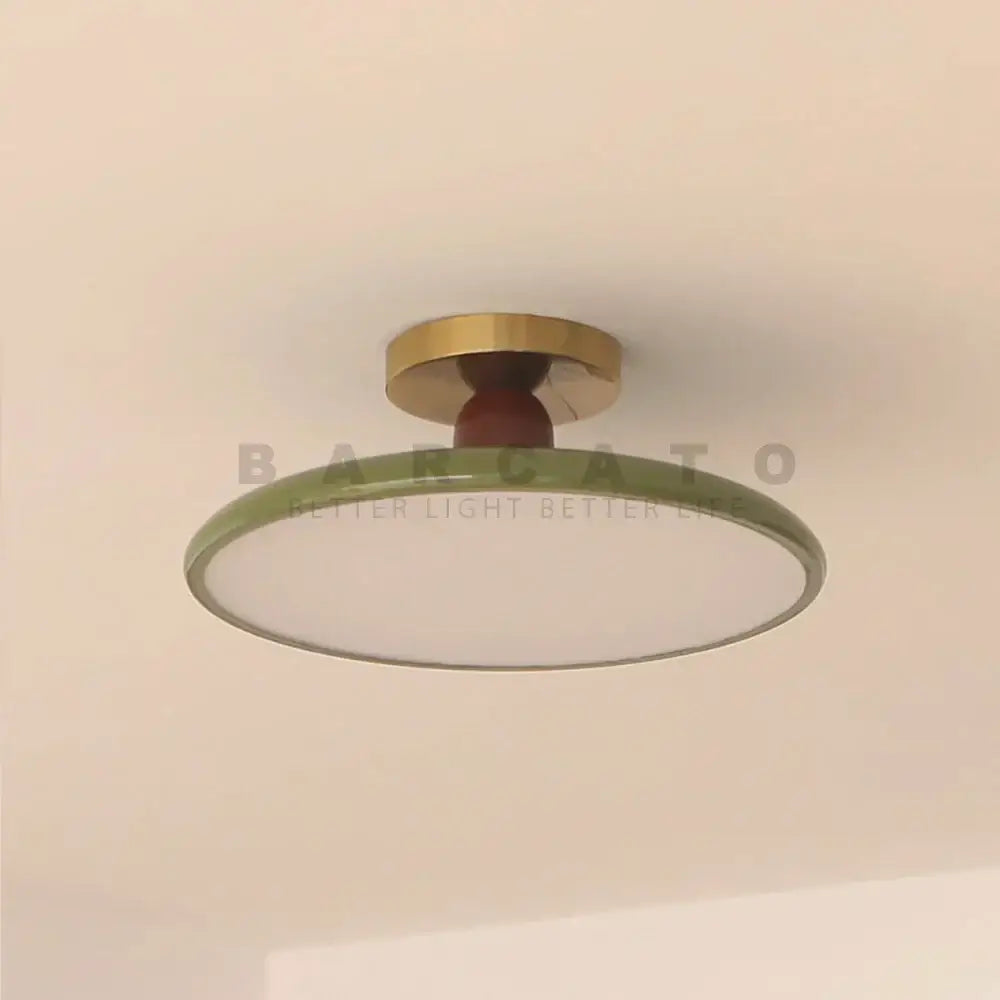 Modern olive green led ceiling light with brass mounting ring and wooden stem for living room illumination